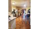 Functional kitchen featuring stainless steel appliances, a dining table, and view into the home at 5301 W Vernon Ave, Phoenix, AZ 85035