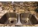 Close-up of a stainless steel kitchen sink with granite countertops and a tiled backsplash at 5301 W Vernon Ave, Phoenix, AZ 85035