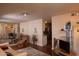 Spacious living room featuring hardwood floors, a wall mirror and modern lighting fixtures at 5301 W Vernon Ave, Phoenix, AZ 85035