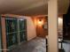 Covered patio with secure sliding glass doors and outdoor lighting at 5301 W Vernon Ave, Phoenix, AZ 85035