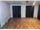 Large dance or flex studio featuring hardwood floors, clean white walls and black out curtains at 5301 W Vernon Ave, Phoenix, AZ 85035