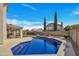 Sparkling pool and landscaped backyard oasis, perfect for relaxation and entertaining at 5611 W Blackhawk Dr, Glendale, AZ 85308