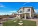 Beautiful backyard featuring synthetic grass, covered patio and sparkling pool at 5611 W Blackhawk Dr, Glendale, AZ 85308