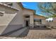 Close up of a well-maintained home featuring a decorative front door and desert landscaping at 5611 W Blackhawk Dr, Glendale, AZ 85308