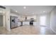 Bright kitchen with stainless steel appliances, white cabinetry, tile floors, and ample counter space at 5638 N 61St Ln, Glendale, AZ 85301