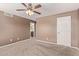 Bedroom featuring neutral walls, carpet and door to bath at 6755 S Tucana Ln, Gilbert, AZ 85298