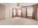 Bedroom featuring three windows, neutral walls, and carpet at 6755 S Tucana Ln, Gilbert, AZ 85298