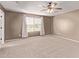 Tranquil bedroom with large window, carpet, ceiling fan and curtains at 6755 S Tucana Ln, Gilbert, AZ 85298