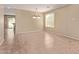 Neutral-toned dining room with tiled floor, a window and a stylish pendant light fixture at 6755 S Tucana Ln, Gilbert, AZ 85298