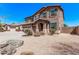 Wonderful two-story home with a three-car garage, desert landscaping and a private driveway at 6755 S Tucana Ln, Gilbert, AZ 85298