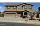 Two-story home boasts a three-car garage, tiled roof, and neutral-toned stucco at 6755 S Tucana Ln, Gilbert, AZ 85298