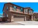 Stunning two-story home featuring a three-car garage and a charming, neutral-toned exterior at 6755 S Tucana Ln, Gilbert, AZ 85298