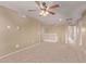 Upstairs loft area with carpet, ceiling fan, and neutral paint at 6755 S Tucana Ln, Gilbert, AZ 85298