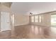 Open living room featuring tile flooring, a ceiling fan and sliding glass doors to backyard at 6755 S Tucana Ln, Gilbert, AZ 85298