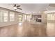 Open living room with tile floors, leading into the kitchen with lots of natural light at 6755 S Tucana Ln, Gilbert, AZ 85298