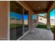 Covered patio area with sliding glass doors leading to backyard at 6755 S Tucana Ln, Gilbert, AZ 85298