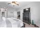 Bedroom with a large dresser, ceiling fan, gray walls, and wood-look floors at 705 W Queen Creek Rd # 1154, Chandler, AZ 85248