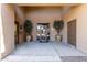 Inviting building entrance featuring decorative plants and glass door at 705 W Queen Creek Rd # 1154, Chandler, AZ 85248