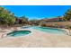 Community pool with spa, surrounded by lounge chairs and well-kept landscaping at 705 W Queen Creek Rd # 1154, Chandler, AZ 85248