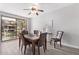 Light-filled dining area includes stylish table and chairs with a view of the patio at 705 W Queen Creek Rd # 1154, Chandler, AZ 85248