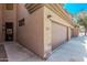 Close-up on townhome garages with desert landscaping and attractive stonework at 705 W Queen Creek Rd # 1154, Chandler, AZ 85248