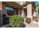 Outdoor patio with shaded seating, grill, and well-kept landscaping at 705 W Queen Creek Rd # 1154, Chandler, AZ 85248