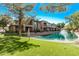 Townhomes overlooking a community waterfront with manicured lawns at 705 W Queen Creek Rd # 1154, Chandler, AZ 85248