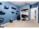 Bedroom featuring neutral walls, carpet, a large window, and shelving for displaying decorative objects at 7274 W Alta Vista Rd, Laveen, AZ 85339