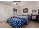 Cozy bedroom featuring a ceiling fan, a window, and decor at 7274 W Alta Vista Rd, Laveen, AZ 85339