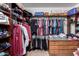 Walk-in closet provides ample storage space with shelving, drawers, and hanging rods for organization at 7274 W Alta Vista Rd, Laveen, AZ 85339