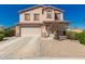 Charming two-story home featuring a two-car garage and inviting front landscaping at 7274 W Alta Vista Rd, Laveen, AZ 85339