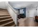 Bright living room featuring staircase, a comfortable recliner set, and neutral paint at 7274 W Alta Vista Rd, Laveen, AZ 85339