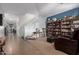 Inviting living room with plush seating, a decorative bookcase, and ample natural light at 7274 W Alta Vista Rd, Laveen, AZ 85339