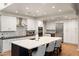 Spacious kitchen featuring an expansive island, modern appliances, and sleek cabinetry at 7937 E Solano Dr, Scottsdale, AZ 85250