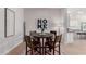 Cozy dining area features a round table and stylish decor, adjacent to the modern kitchen at 8025 W Gardenia Ave, Glendale, AZ 85303