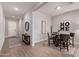 Open dining room with modern furnishings, light tile floors, and an inviting atmosphere for gatherings at 8025 W Gardenia Ave, Glendale, AZ 85303