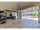 Spacious garage with ample storage and open doors leading to the outside at 8025 W Gardenia Ave, Glendale, AZ 85303