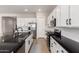 Modern kitchen featuring stainless steel appliances and sleek black countertops at 8025 W Gardenia Ave, Glendale, AZ 85303