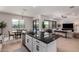 Kitchen island offering views of the dining area, backyard, and outdoor living space at 8025 W Gardenia Ave, Glendale, AZ 85303