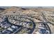 Drone view of the Primary-planned community with single-Gathering homes, desert landscaping, and mountain views at 8857 S 167Th Ln, Goodyear, AZ 85338