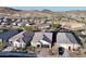 Aerial view of well-kept homes displaying beautiful desert landscaping in a neighborhood setting at 8857 S 167Th Ln, Goodyear, AZ 85338