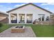 Outdoor space featuring brick fire pit, covered patio with BBQ, and seating area at 8857 S 167Th Ln, Goodyear, AZ 85338