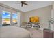 Bright bedroom with large windows, neutral color palette, ceiling fan, and modern furniture at 8857 S 167Th Ln, Goodyear, AZ 85338