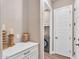 Well-organized laundry room with cabinetry, countertop space, and modern appliances at 8857 S 167Th Ln, Goodyear, AZ 85338