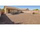 Large backyard features gravel, a patio, and privacy fencing at 10792 W Elm Ln, Avondale, AZ 85323