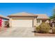 Cozy single-story house with a two-car garage and low-maintenance front yard at 10792 W Elm Ln, Avondale, AZ 85323