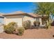 Inviting single-story residence featuring a two-car garage and desert-friendly landscaping at 10792 W Elm Ln, Avondale, AZ 85323