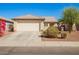 Charming single-story home with a two-car garage and manicured landscaping at 10792 W Elm Ln, Avondale, AZ 85323