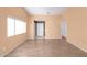 Open living area with laminate floors, lots of light, and neutral color palette at 10792 W Elm Ln, Avondale, AZ 85323