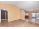 Bright and spacious living room featuring laminate flooring and neutral paint at 10792 W Elm Ln, Avondale, AZ 85323